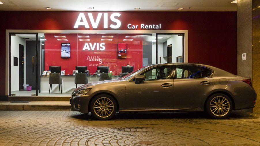 A rental sits in front of Avis