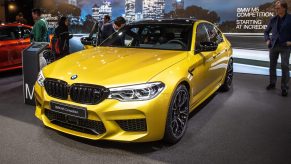 Gold BMW M5 Competition is displayed during the second press day at the 89th Geneva International Motor Show