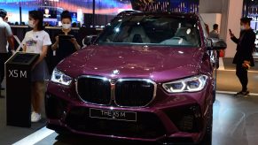 A purple BMW X5 M SAV is on display during the 19th Shanghai International Automobile Industry Exhibition (Auto Shanghai 2021)