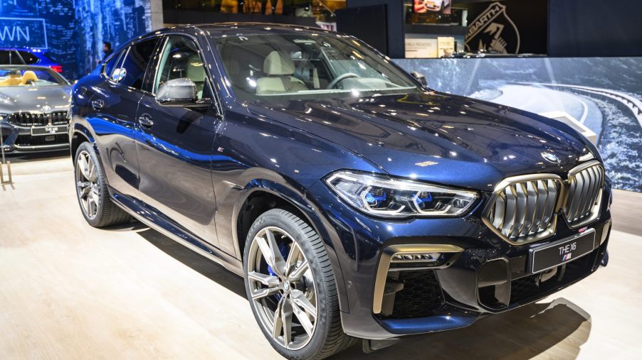 Blue BMW X6 luxury crossover SUV on display at Brussels Expo