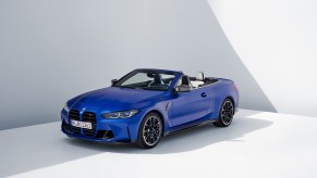 A blue 2022 BMW M4 convertible