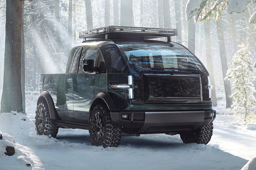 The 2023 Canoo pickup in the forrest