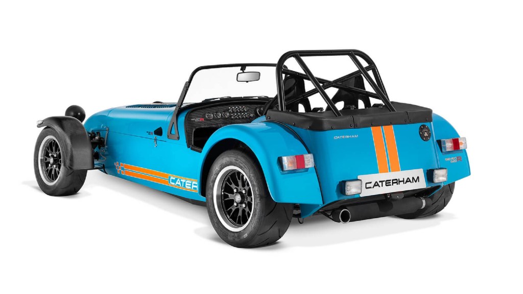 The rear 3/4 view of a blue-and-orange Caterham Seven 620R