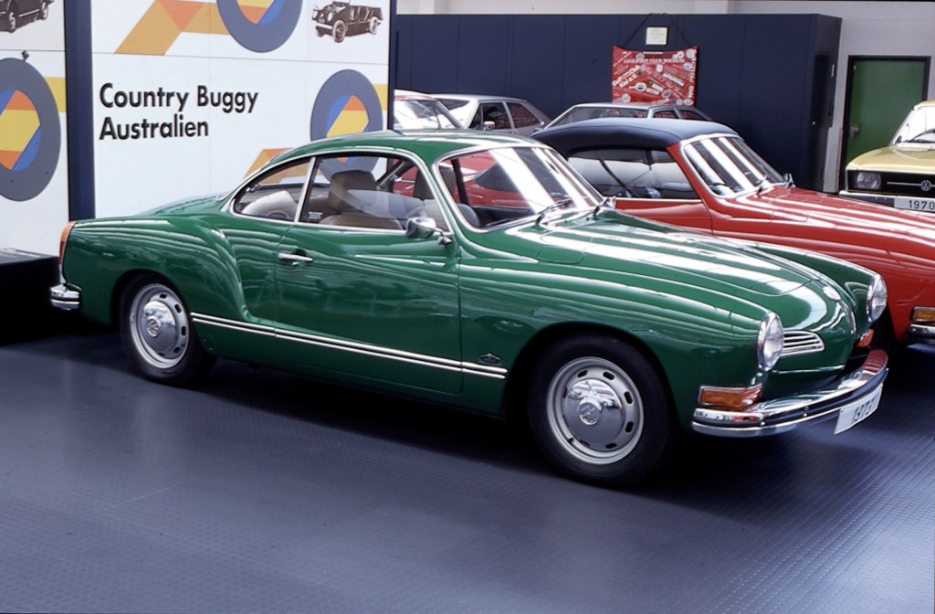 An emerald green classic 1973 Karmann Ghia coup on display