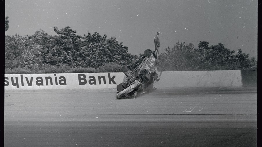 Dale Earnhardt's NASCAR car flips at Pocono Raceway.