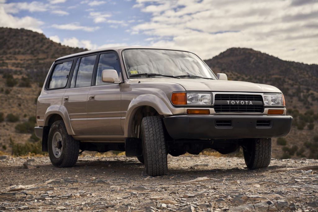 a 1991 Toyota Land Cruiser 80 series parked off-road in the mountains 