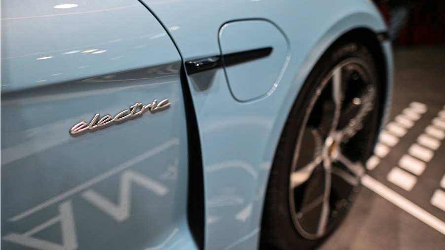 A light blue Porsche Taycan 4S electric vehicle