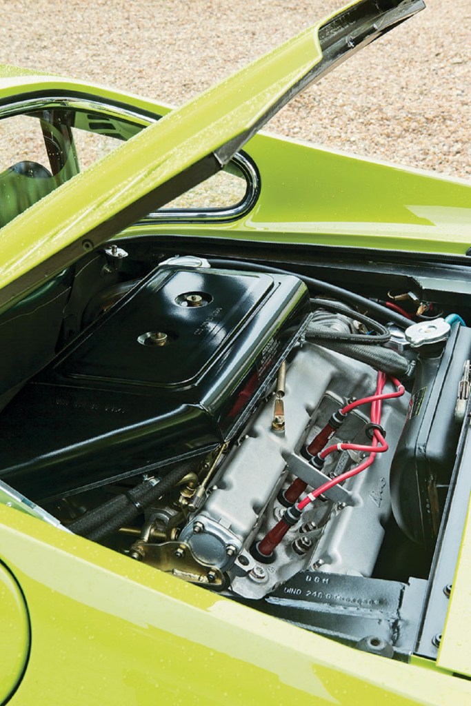 The V6 engine in a bright-green Ferrari Dino 246 GT