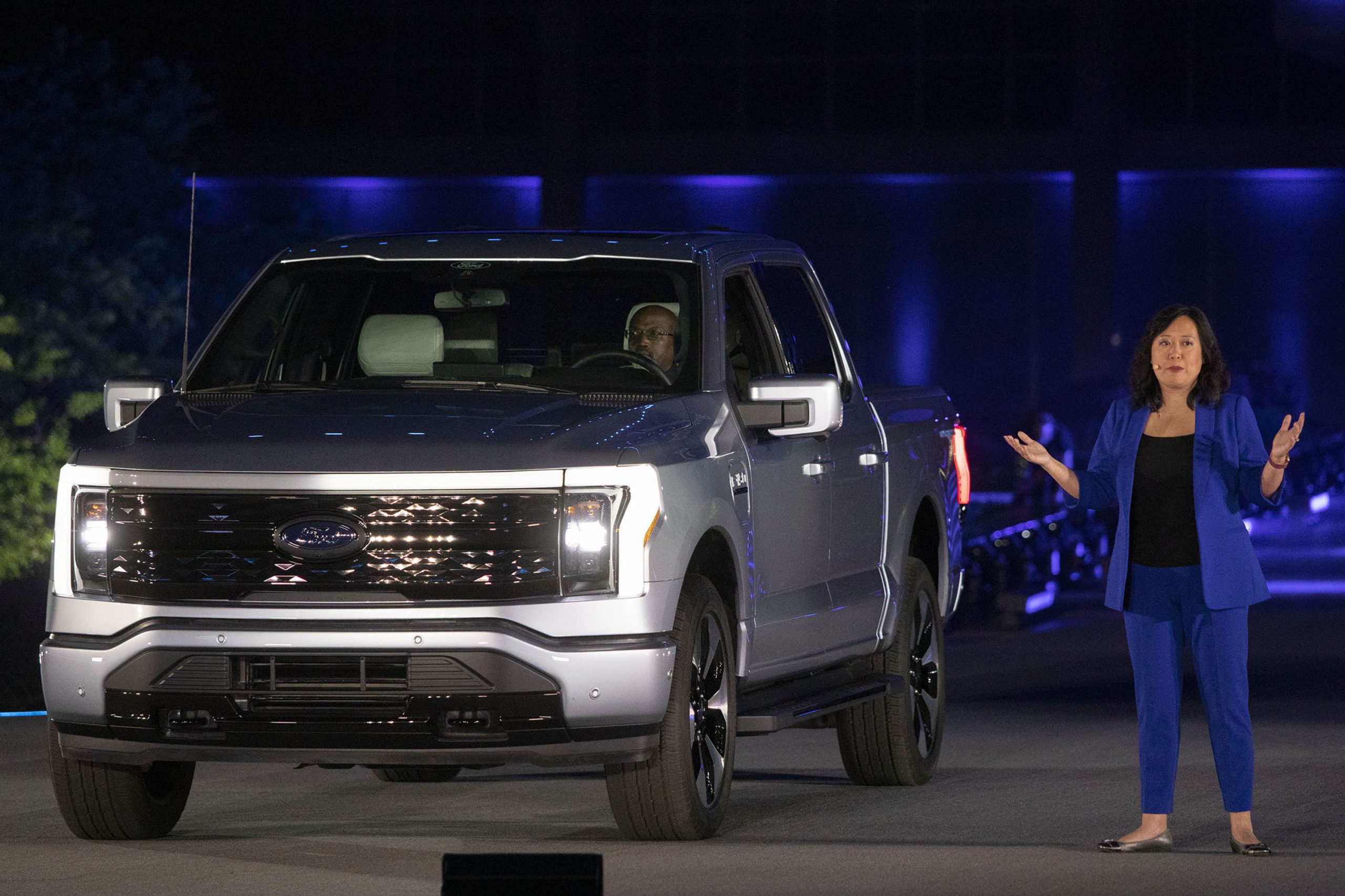 Linda Zhang, Chief Engineer, speaks at the reveal of the new all-electric Ford F-150 Lightning pickup truck in silver at Ford World Headquarters