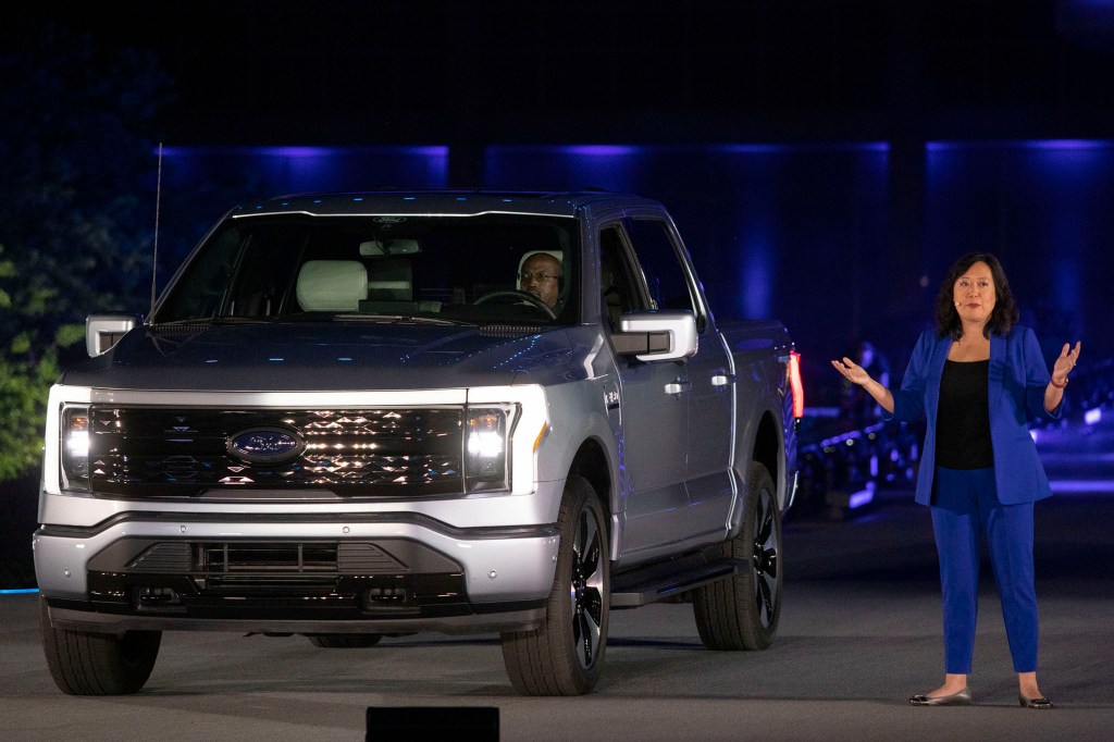 Linda Zhang, Chief Engineer, speaks at the reveal of the new all-electric Ford F-150 Lightning pickup truck in silver at Ford World Headquarters
