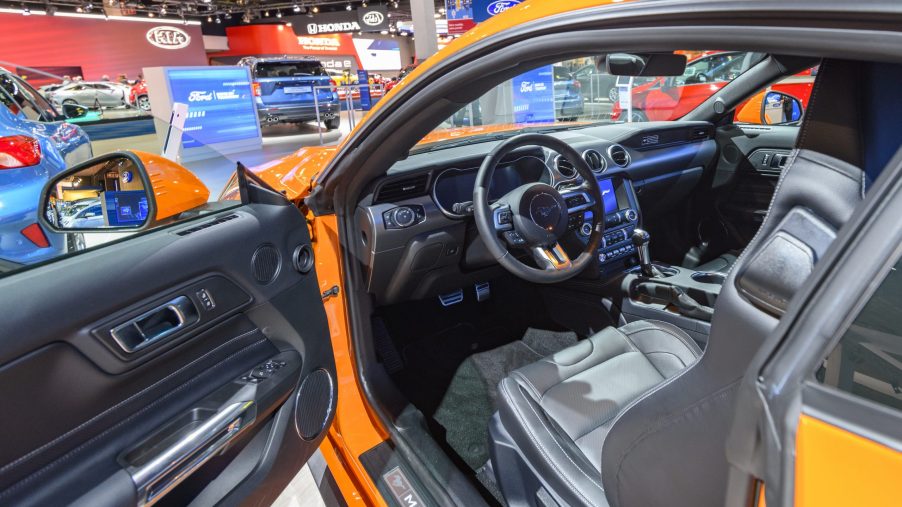 Orange Ford Mustang 5.0 V8 sports car on display at Brussels Expo