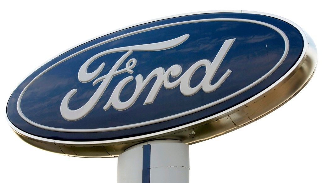 A blue oval Ford motor company sign