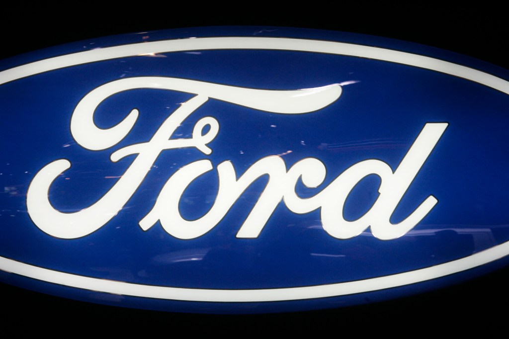 A glossy blue oval logo with the word "Ford" in white