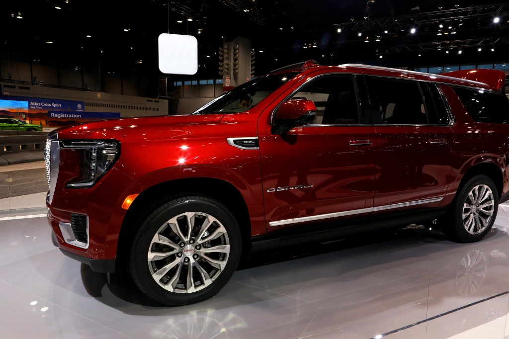 A 2021 GMC Yukon at a car show. The Yukon is one of the largest SUVs you can buy, but is it as safe as the Ford Expedition?