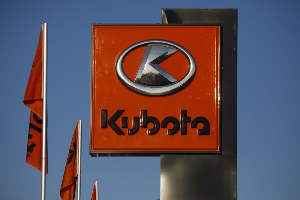 Kubota logo against a blue sky
