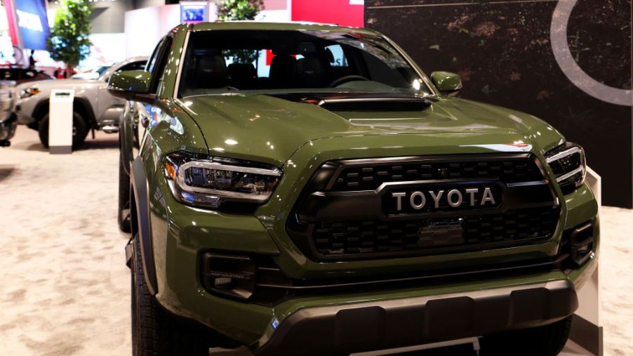the 2020 Toyota Tacoma trd pro in army green on display at an auto show