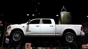 2021 ram 1500 at an auto show hoisted up on display for all to see