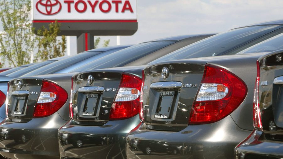 a row of 2002 Toyota Camry models at a dealership