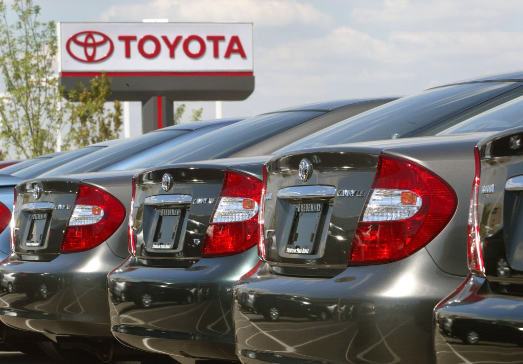 a row of 2002 Toyota Camry models at a dealership