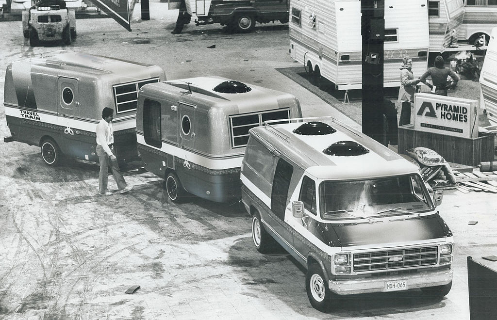 RV triple towing in an old black and white photo 