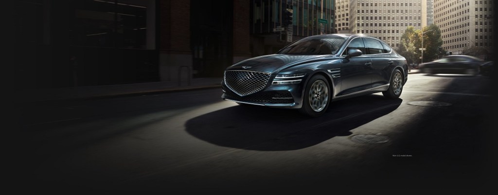 2021 Genesis g80 review pictured in a city 