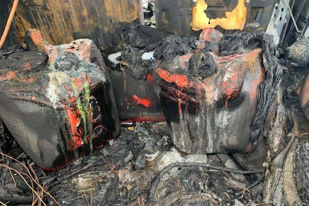 melted gas cans in the back of the Hummer H2