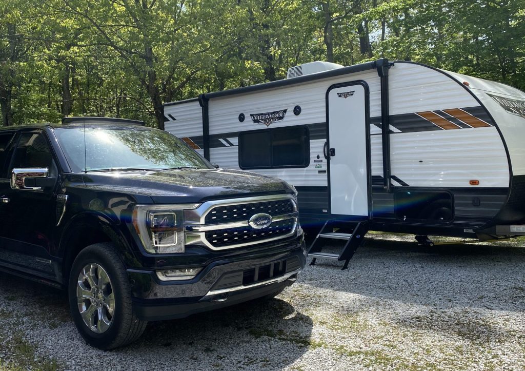 The Ford F-150 PowerBoost with a WildWood Camper