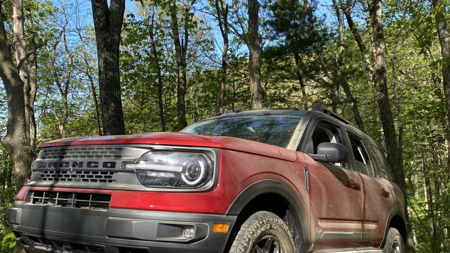 A red 2021 Ford Bronco Sport parked on top of a rock