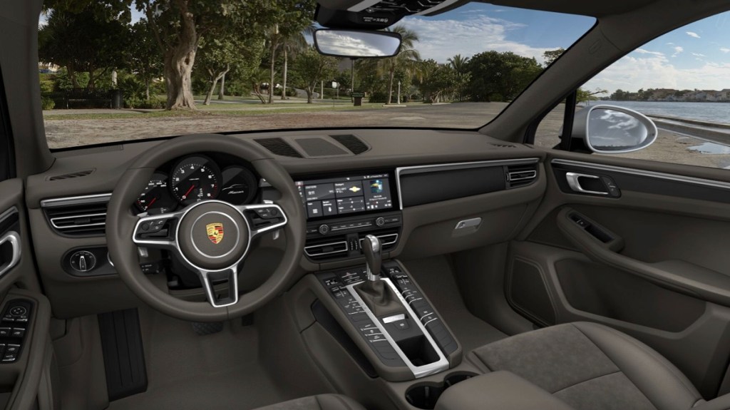 The interior of the 2021 Porsche Macan with grey seats. 