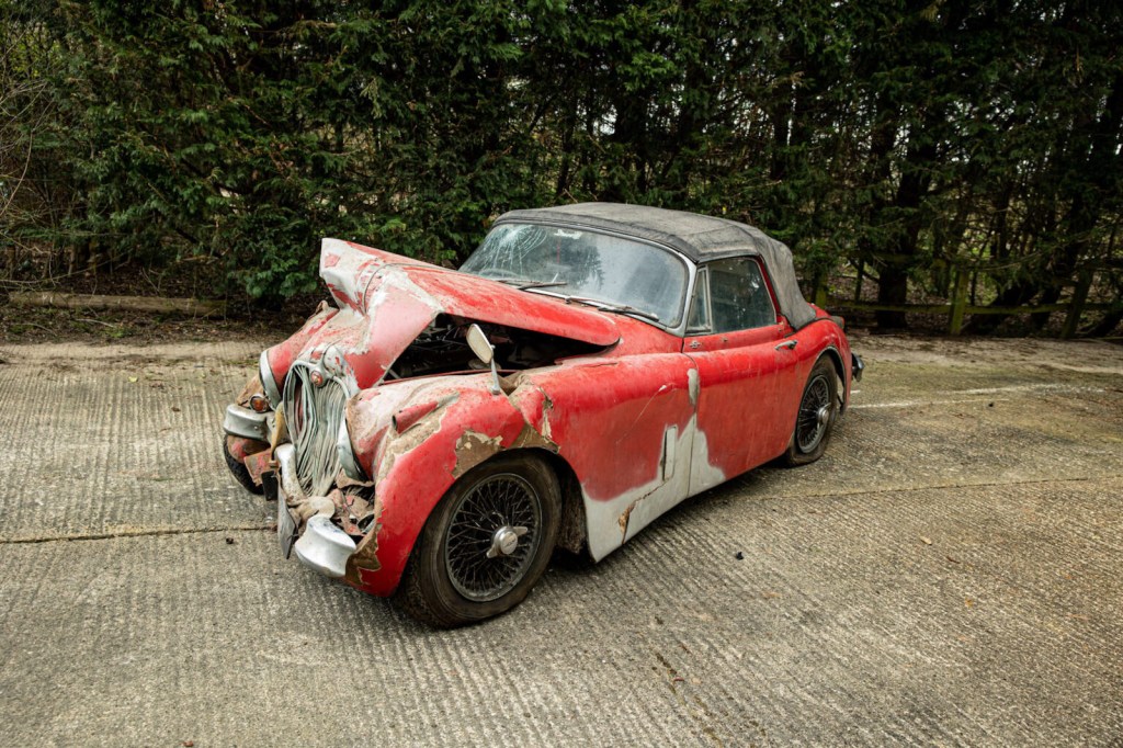 smashed red 1960 Jaguar XK 150S is going to auction at Bonhams 