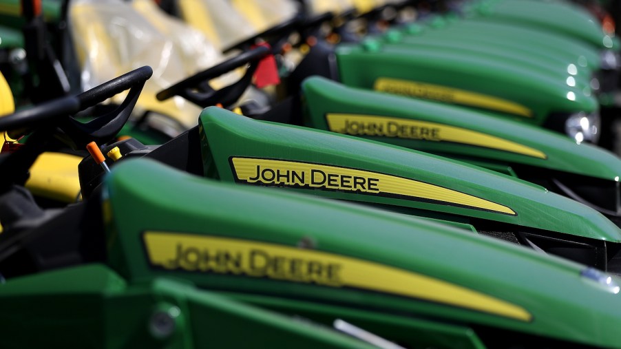 John Deere riding lawn mowers in front of a store