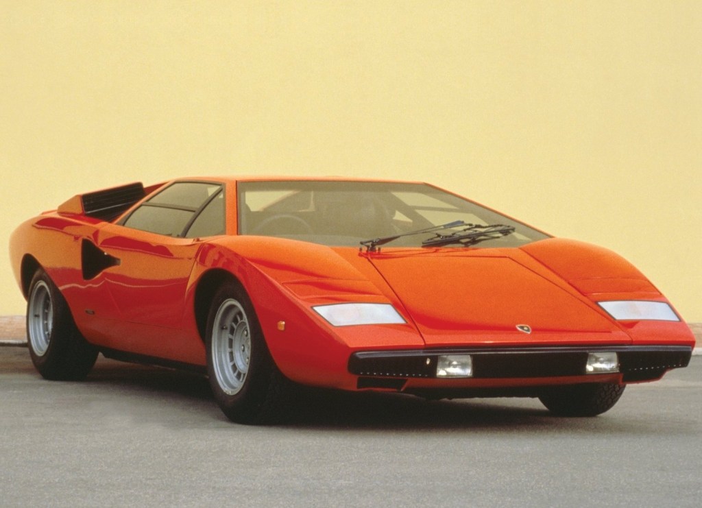 An image of a red Lamborghini Countach LP400 parked outdoors.