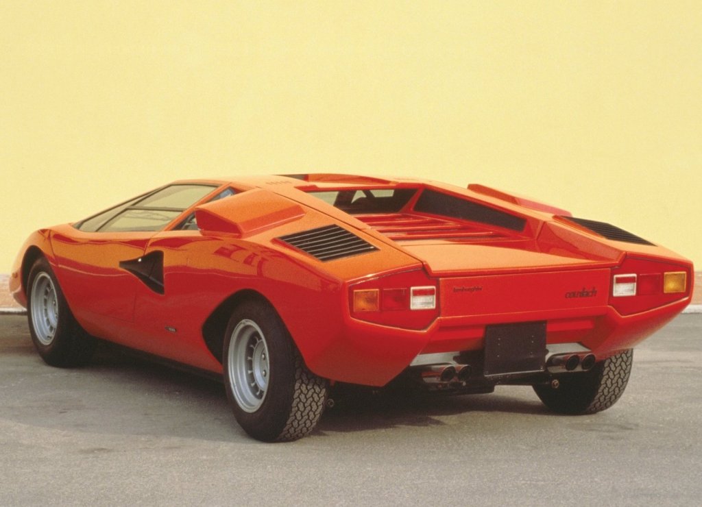 An image of a red Lamborghini Countach LP400 parked outdoors.
