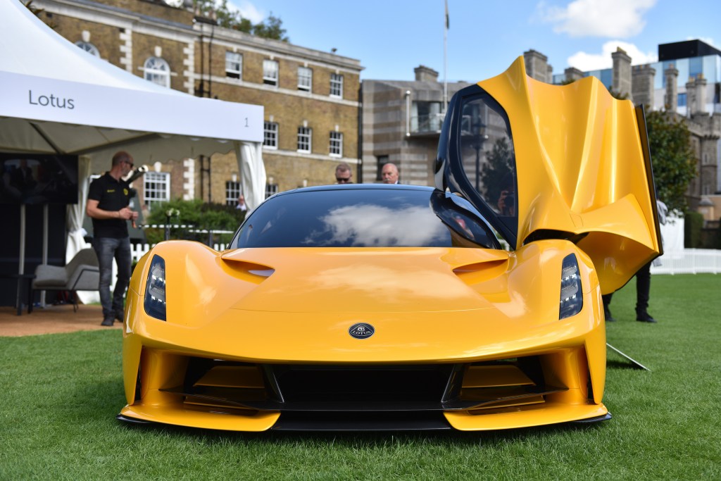 A fully electric yellow Lotus Evija hypercar is displayed during the London Concours at Honourable Artillery Company