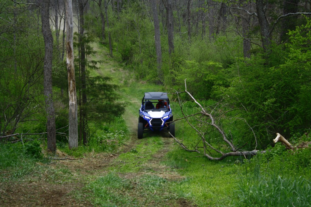 2021 Polaris RZR Trail S Sport ripping through a wooded trail