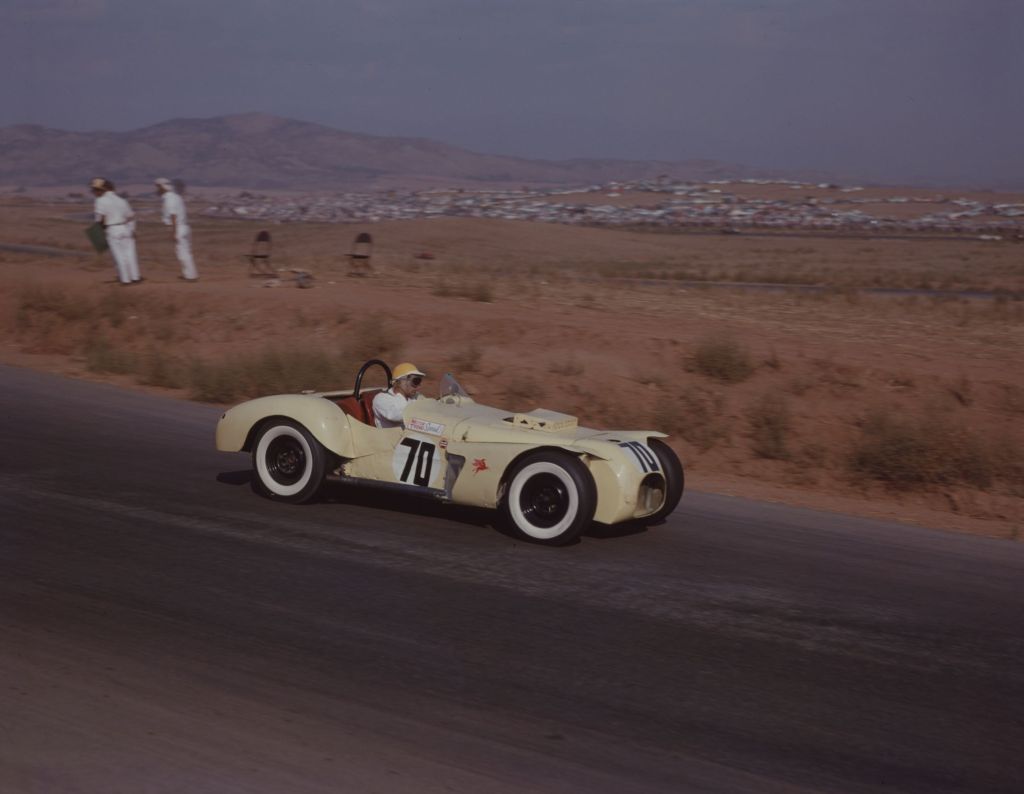 Max Balchowsky driving the pale-yellow Old Yeller I at the 1958 Times Grand Prix