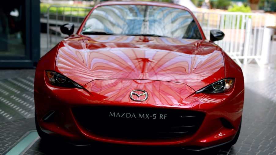 The roof of the Sony Center reflects on the bonnet of the red Mazda MX-5 RF during the Mazda Spring Cocktail at Sony Centre