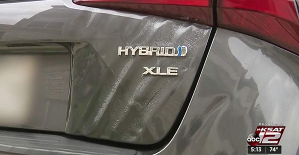 rear shot of rippled truck on Prius