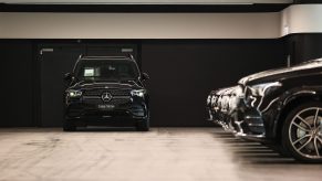 A new Mercedes-Benz GLE SUV and other automobiles in a storage garage at a Daimler AG showroom in Frankfurt, Germany
