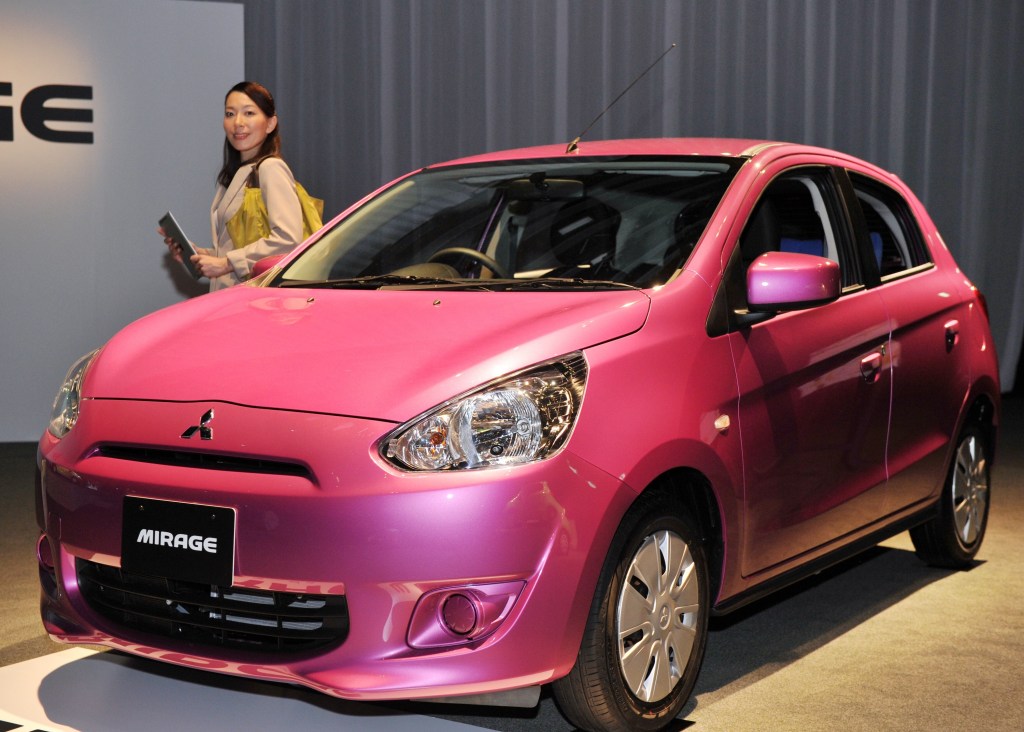 On our list of most hated cars of all time is the Mitsubishi Mirage, which takes center stage in a Tokyo showroom. 