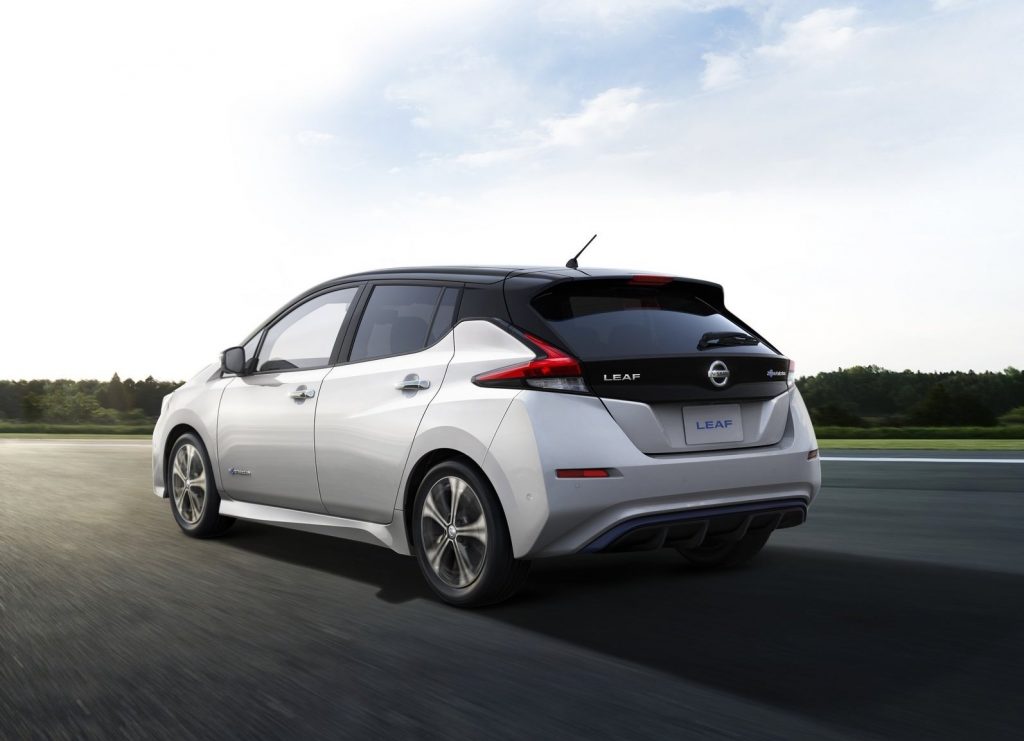 An image of a white Nissan LEAF parked outdoors.