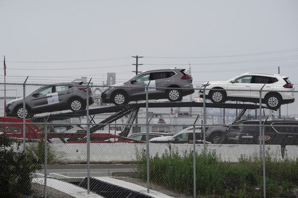 New Nissan Motor Co. Rogue vehicles sit on a car carrier trailer inside an automotive processing terminal operated by WWL Vehicle Services Americas Inc.