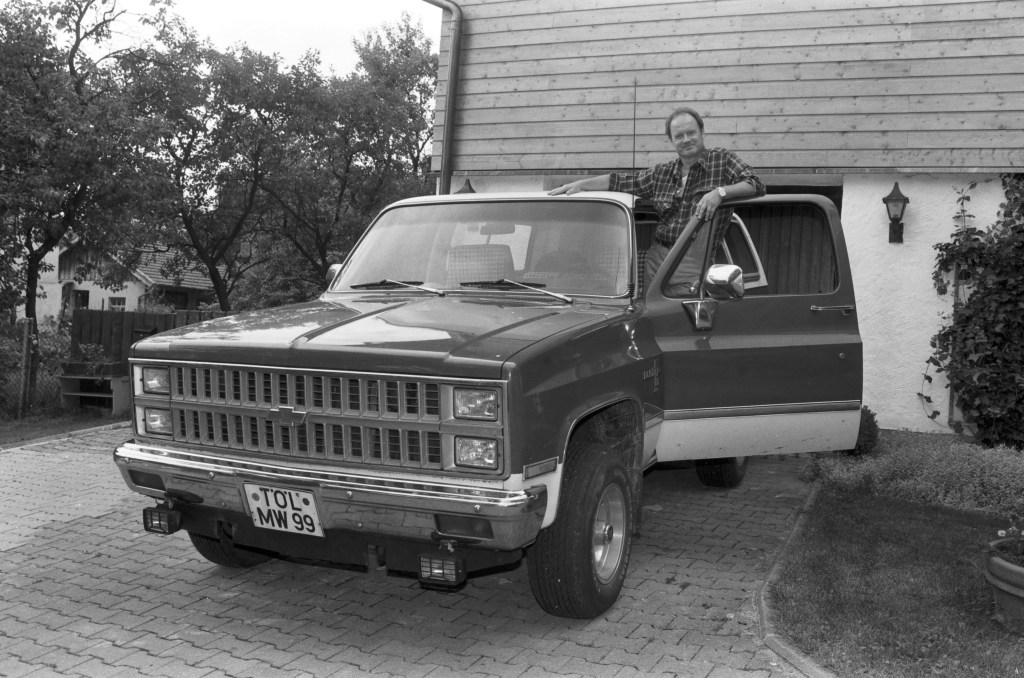 A man and his old Chevy Blazer, circa 1980s.