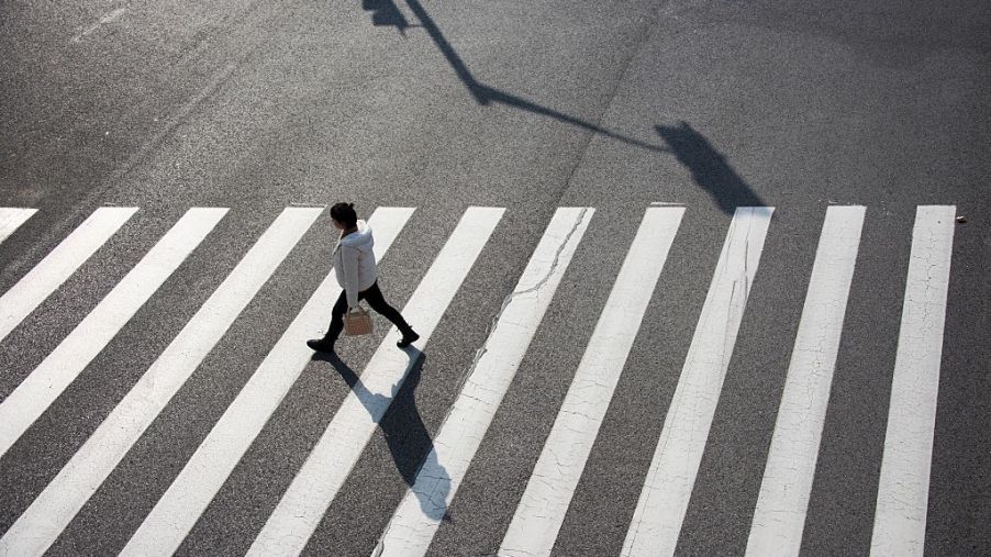 lone pedestrian in crosswalk