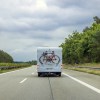 An RV driving down the road with proper RV tires fitment heading to summer vacation