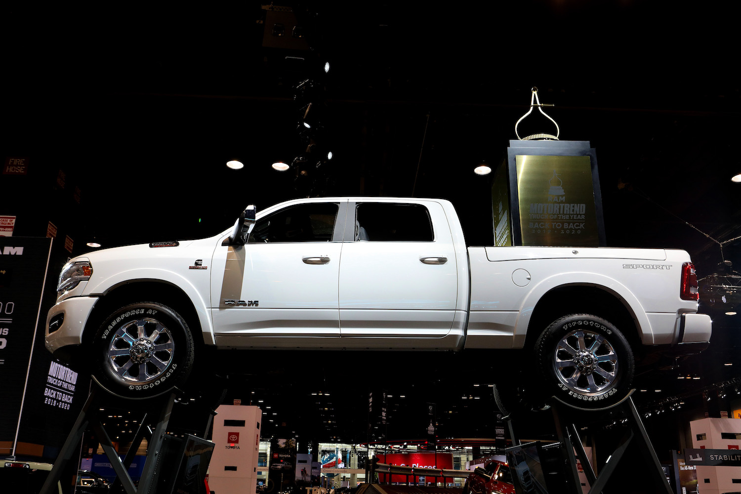 A white Ram 1500 on display at an auto show
