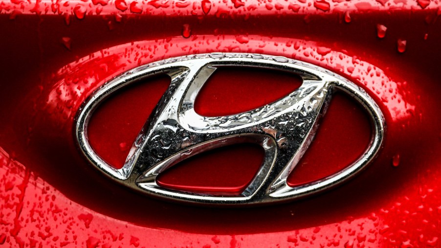 Pictured is the Hyundai logo on a red car, Hyundai recently recalled more than 390,000 cars.