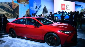 People take a closer look at the new red 2019 Toyota Avalon TRD on display