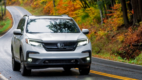 The 2021 Honda Pilot driving down a curvy road