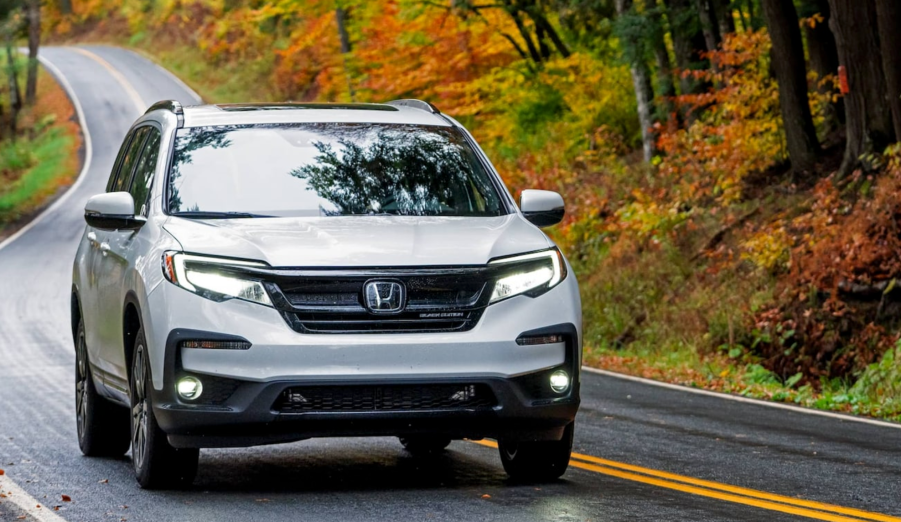 The 2021 Honda Pilot driving down a curvy road